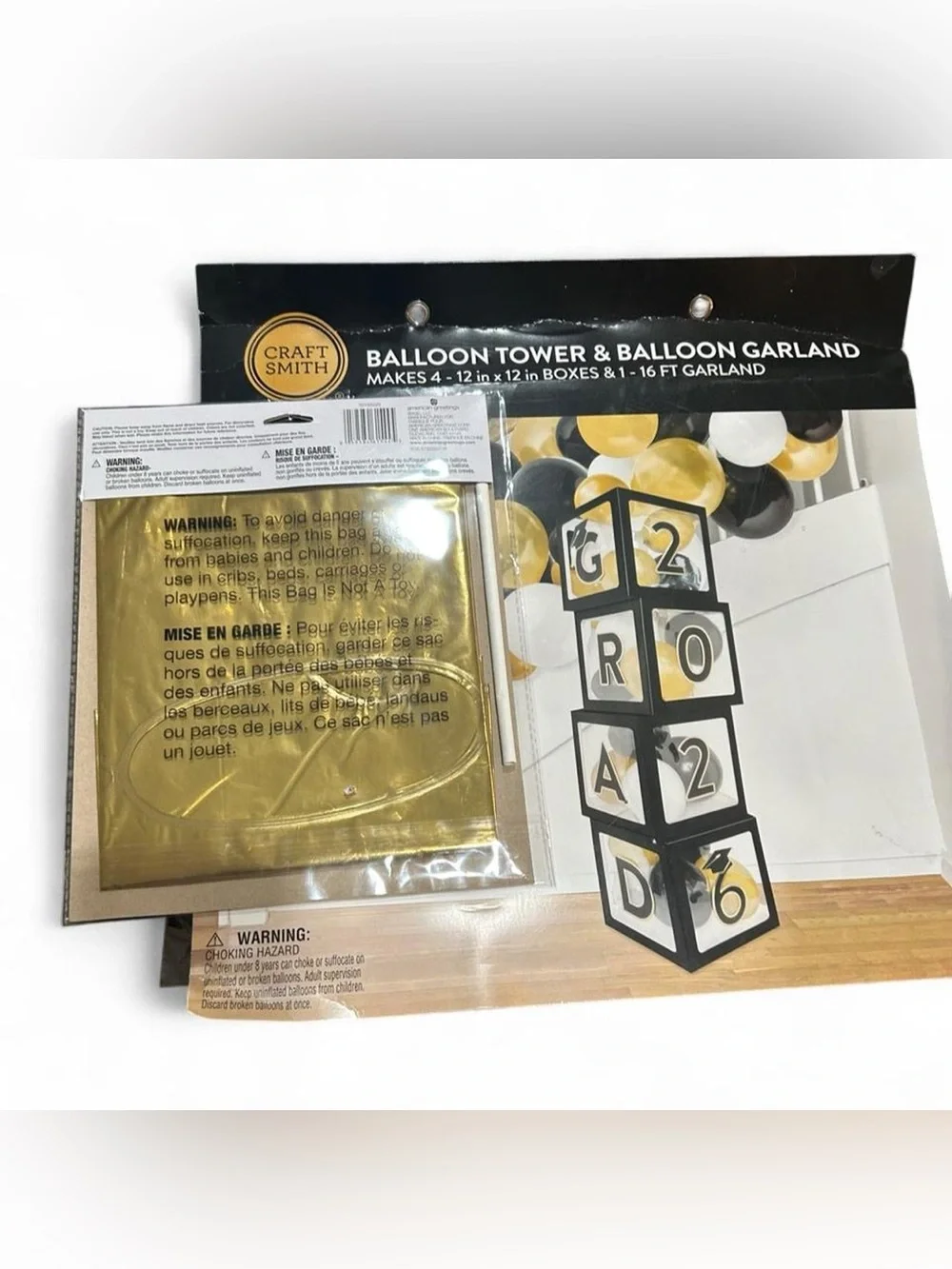 Graduation party decorations - balloon tower and banner with gold and black
